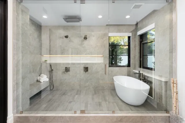 a living room with furniture a dining table and chairs with wooden floor