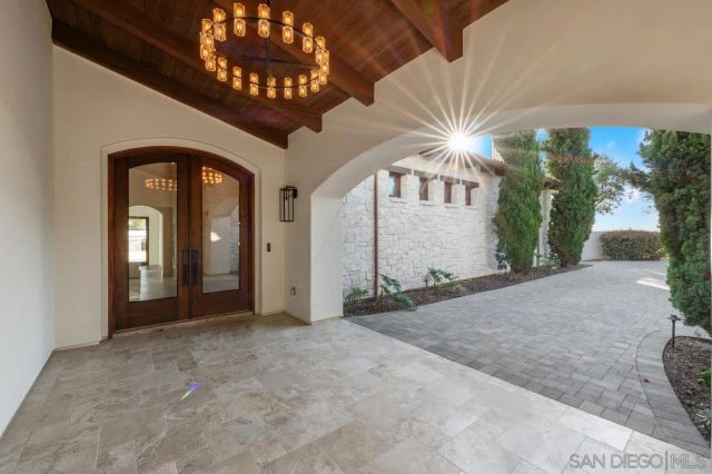 a view of a hallway with a chandelier
