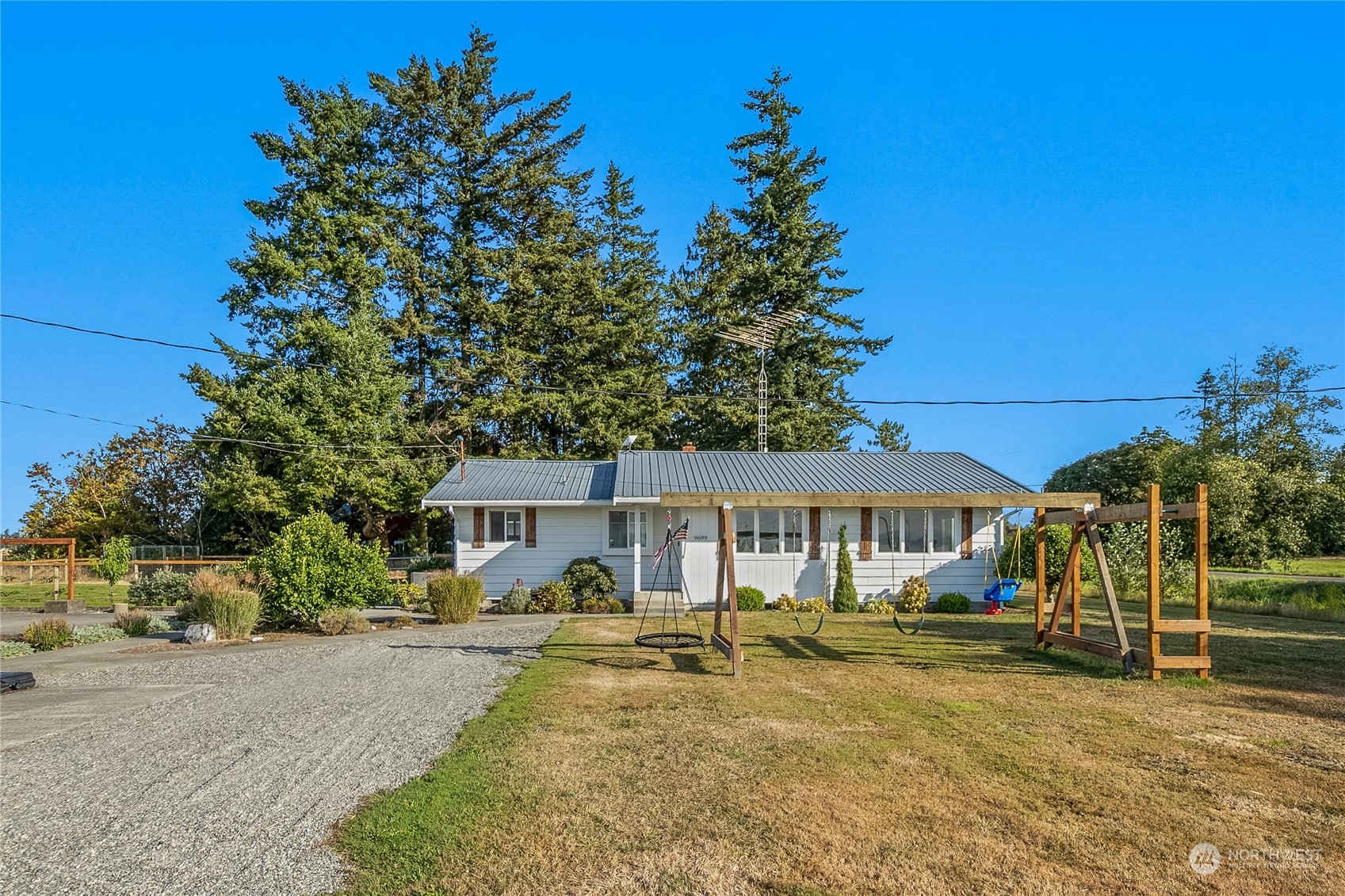 9699 Double Ditch Road Lynden, WA 98264 - Photo 2 of 40 a view of a house with swimming pool and sitting area