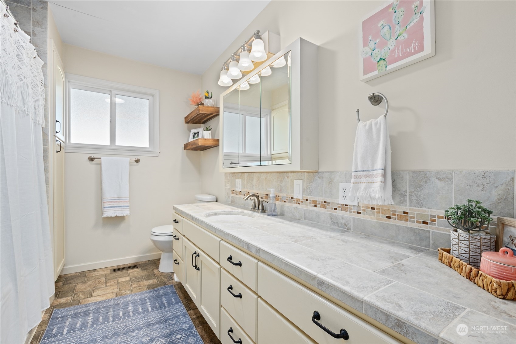 9699 Double Ditch Road Lynden, WA 98264 - Photo 27 of 40 a bathroom with a sink and a mirror
