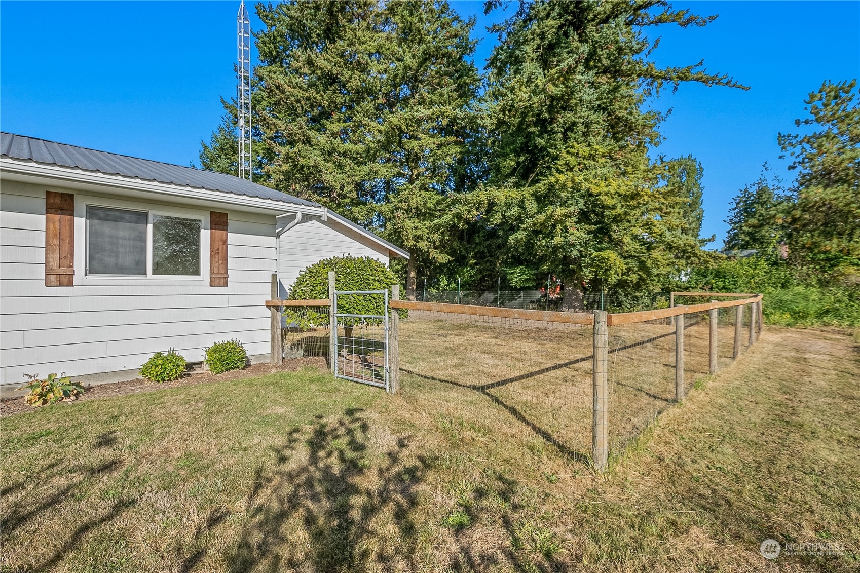 9699 Double Ditch Road Lynden, WA 98264 - Photo 32 of 40 a view of a chairs and table in the backyard
