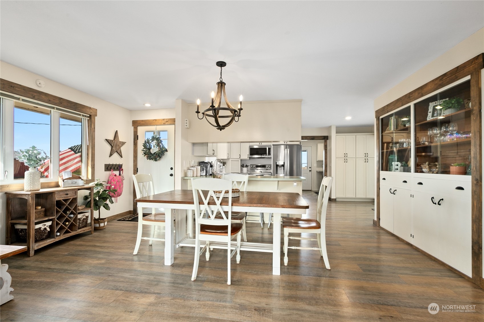 9699 Double Ditch Road Lynden, WA 98264 - Photo 7 of 40 a view of a dining room with furniture window and wooden floor