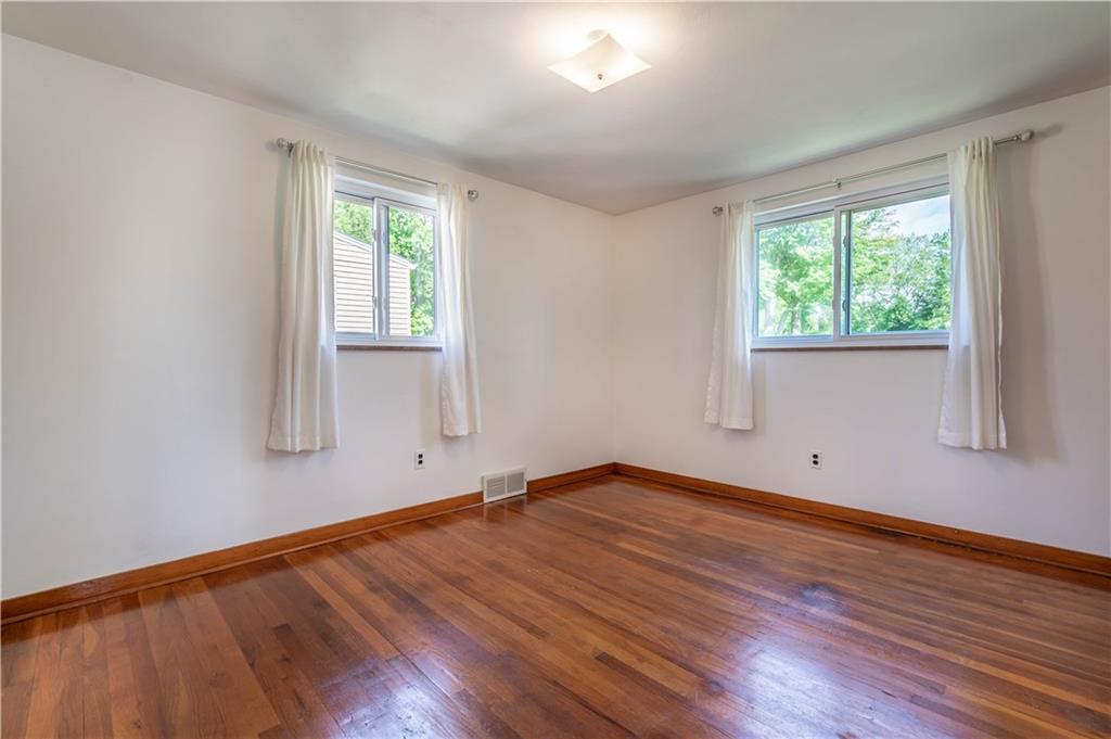 1465 Prospect Road Pittsburgh, PA 15227 - Photo 14 of 25 3RD BEDROOM ALSO WITH HARDWOOD FLOOR AND 2 WINDOWS MAKING IT SO LIGHT AND BRIGHT