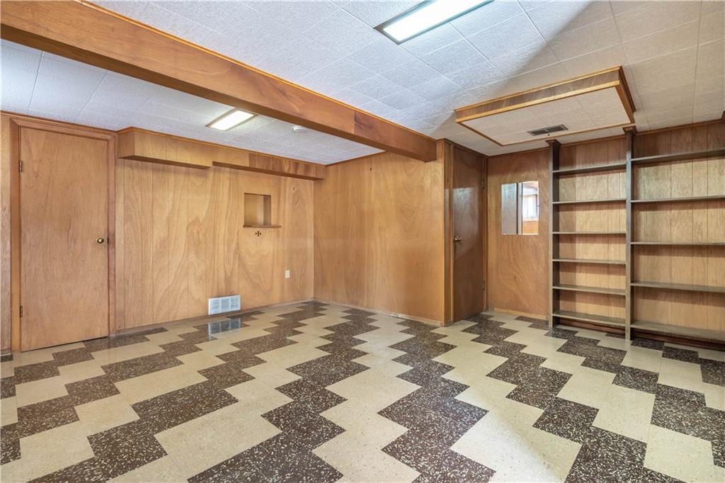 1465 Prospect Road Pittsburgh, PA 15227 - Photo 16 of 25 LOWER LEVEL GAMEROOM WITH BUILT IN SHELVES