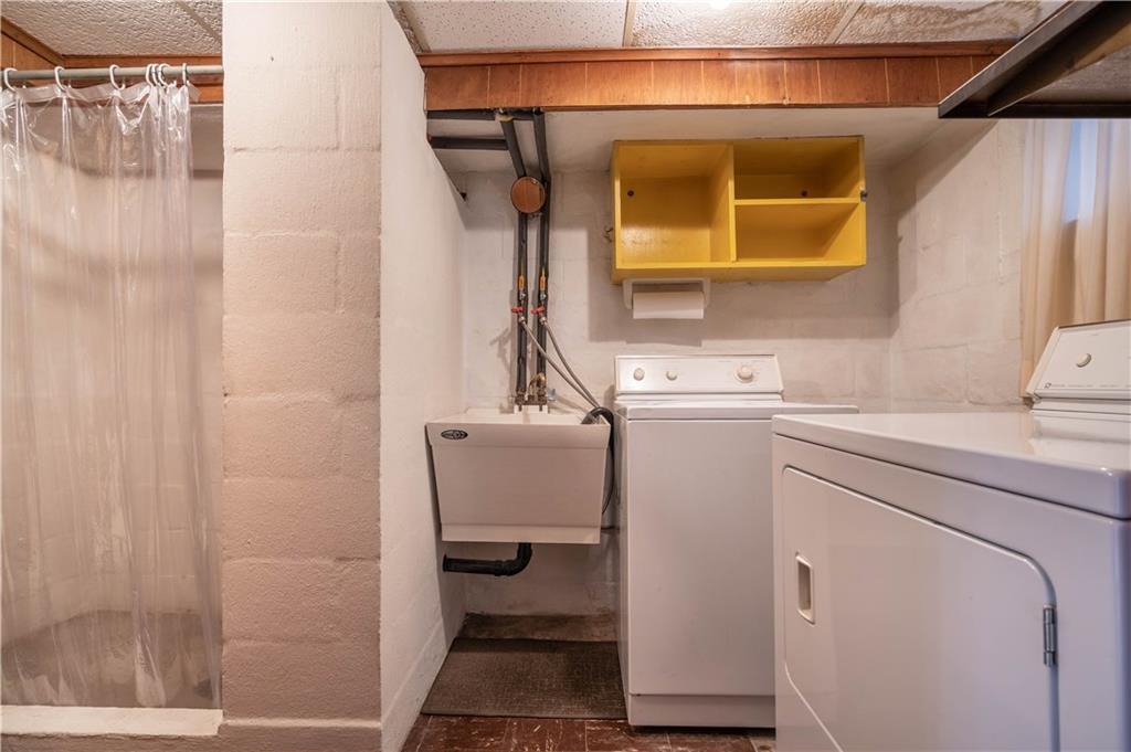 1465 Prospect Road Pittsburgh, PA 15227 - Photo 20 of 25 LAUNDRY AREA WITH SHOWER, TOILET. WASHER/DRYER INCLUDED