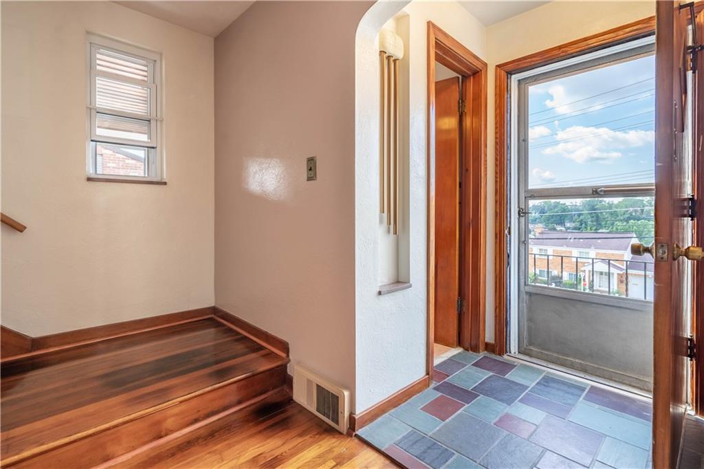 1465 Prospect Road Pittsburgh, PA 15227 - Photo 3 of 25 ENTRY WAY SHOWING THE LOVELY HARDWOOD FLOORS. POWDER ROOM OFF ENTRY
