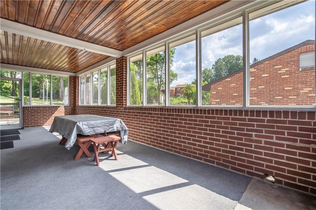 1465 Prospect Road Pittsburgh, PA 15227 - Photo 21 of 25 SPACIOUS SCREENED PORCH OFF KITCHEN EASILY CONVERTED TO A 3 SEASON ROOM