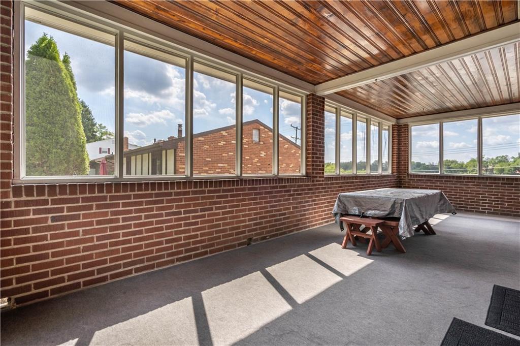 1465 Prospect Road Pittsburgh, PA 15227 - Photo 22 of 25 ANOTHER VIEW OF THE SCREENED PORCH, IDEAL FOR SUMMER MEALS AND RELAXING TIME