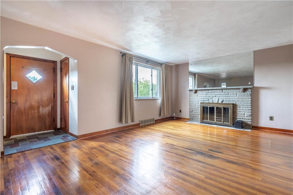 1465 Prospect Road Pittsburgh, PA 15227 - Photo 4 of 25 NICE SIZE LIVING ROOM WITH LB FIREPLACE AND LOVELY HARDWOOD FLOORS