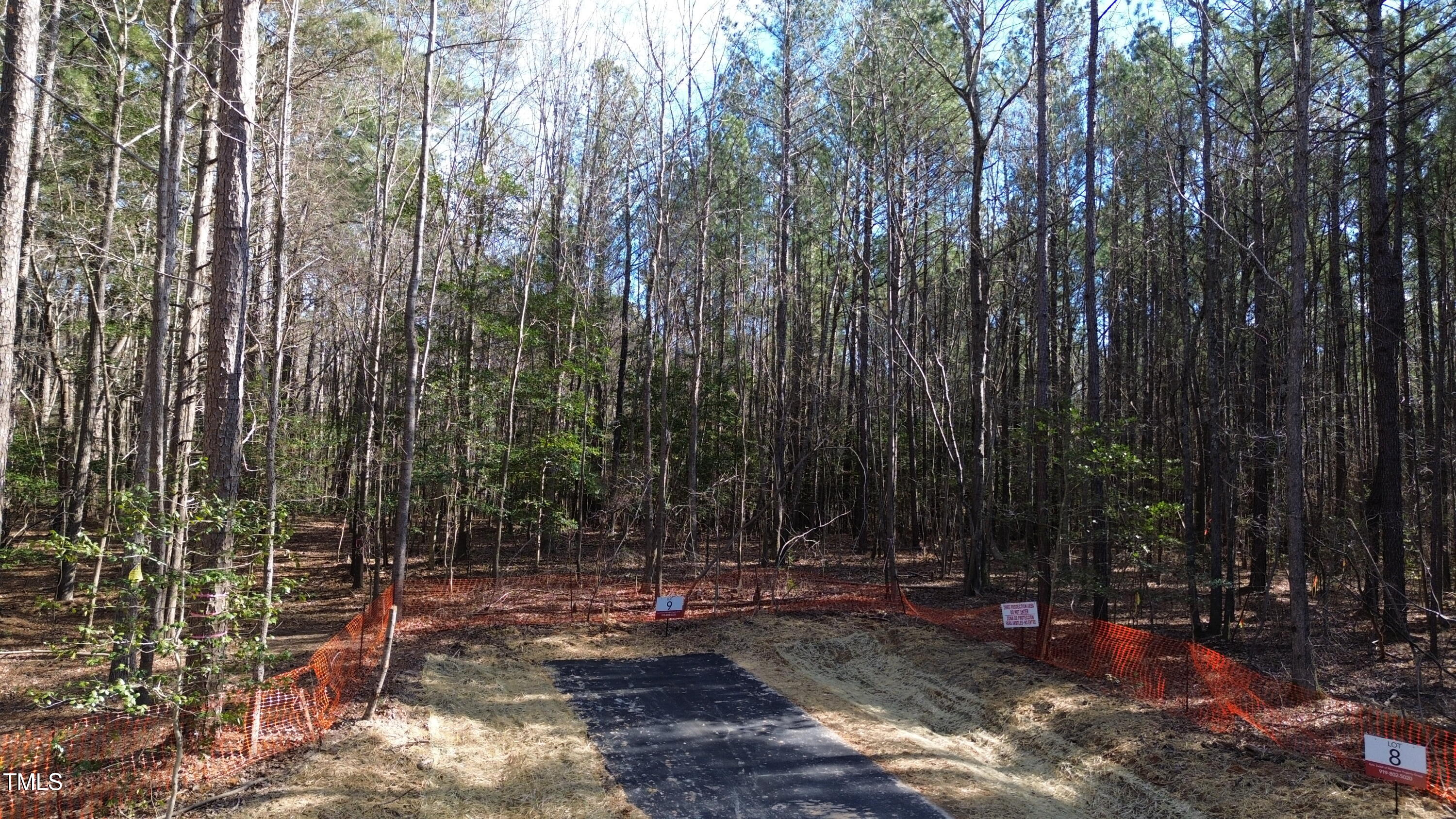 123 Anfield Road New Hill, NC 27562 - Photo 2 of 13 a view of a yard with large trees