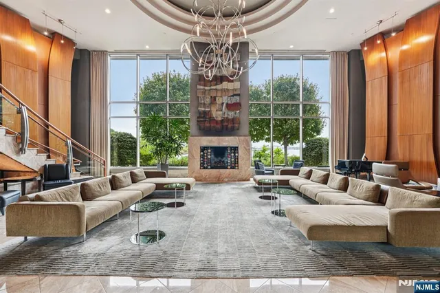 a living room with furniture kitchen view and a dining table