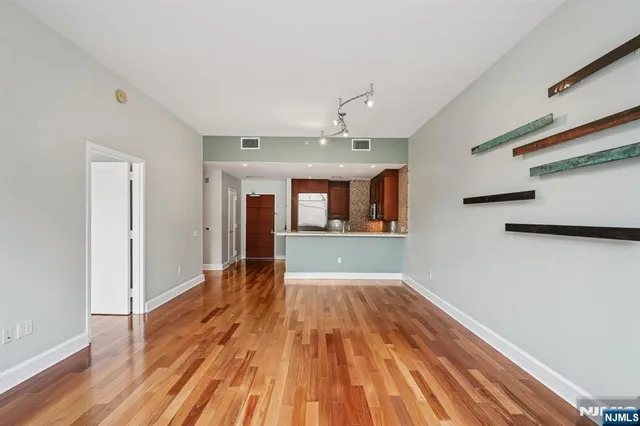 a kitchen with stainless steel appliances granite countertop a stove microwave and sink