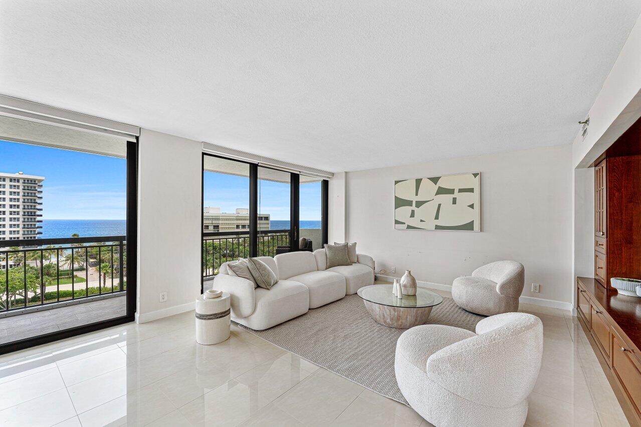 2003 North Ocean Boulevard, Unit 902 Boca Raton, FL 33431 - Photo 4 of 45 a living room with furniture and a flat screen tv