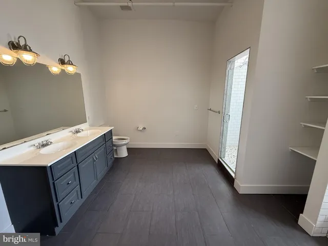 a bathroom with a sink and mirror