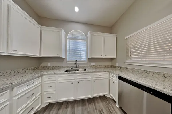 a kitchen with sink cabinets and window