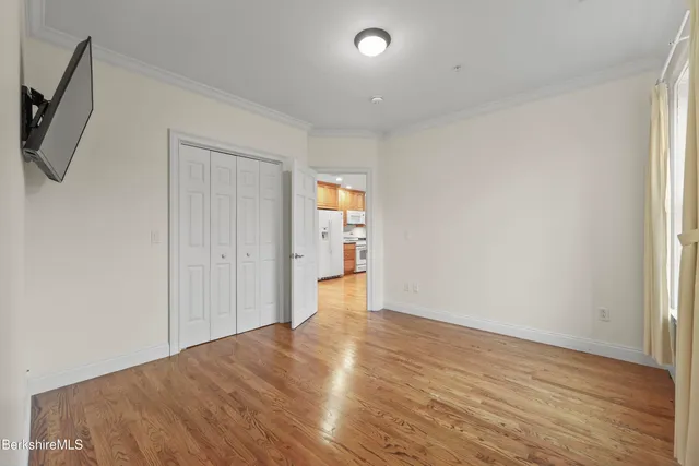 a bathroom with a toilet a sink and a mirror
