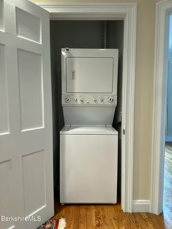 a bathroom with a sink a mirror and shower