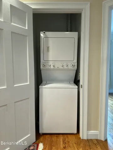 a bathroom with a sink a mirror and shower
