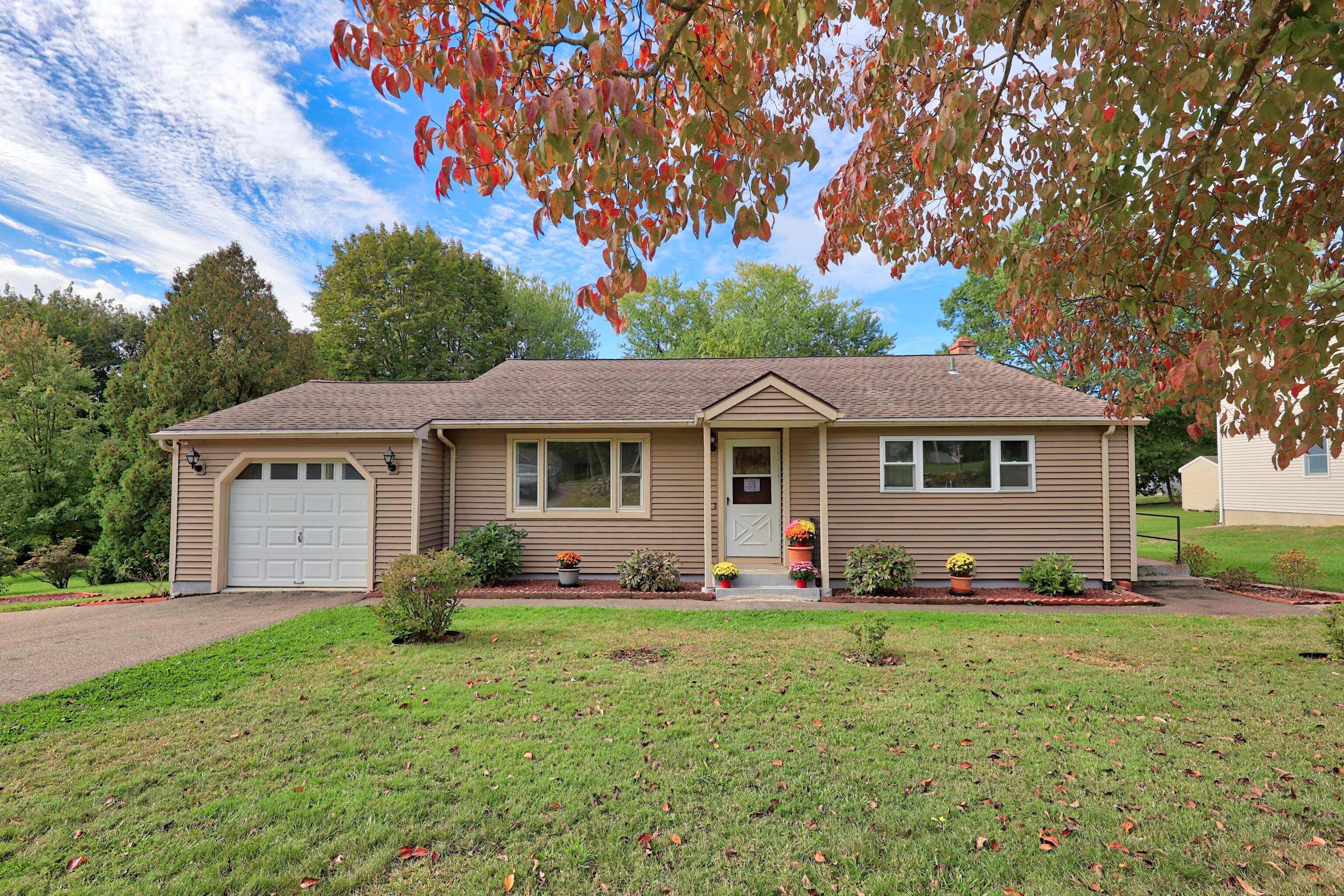 a front view of a house with garden