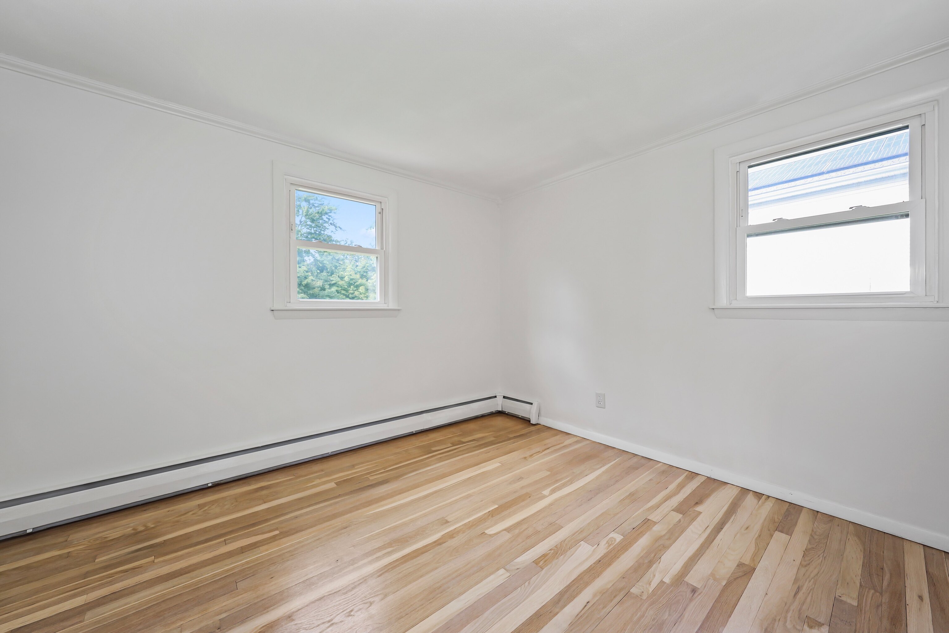 1114 Fienemann Road Farmington, CT 06032 - Photo 17 of 28 wooden floor in an empty room with a window