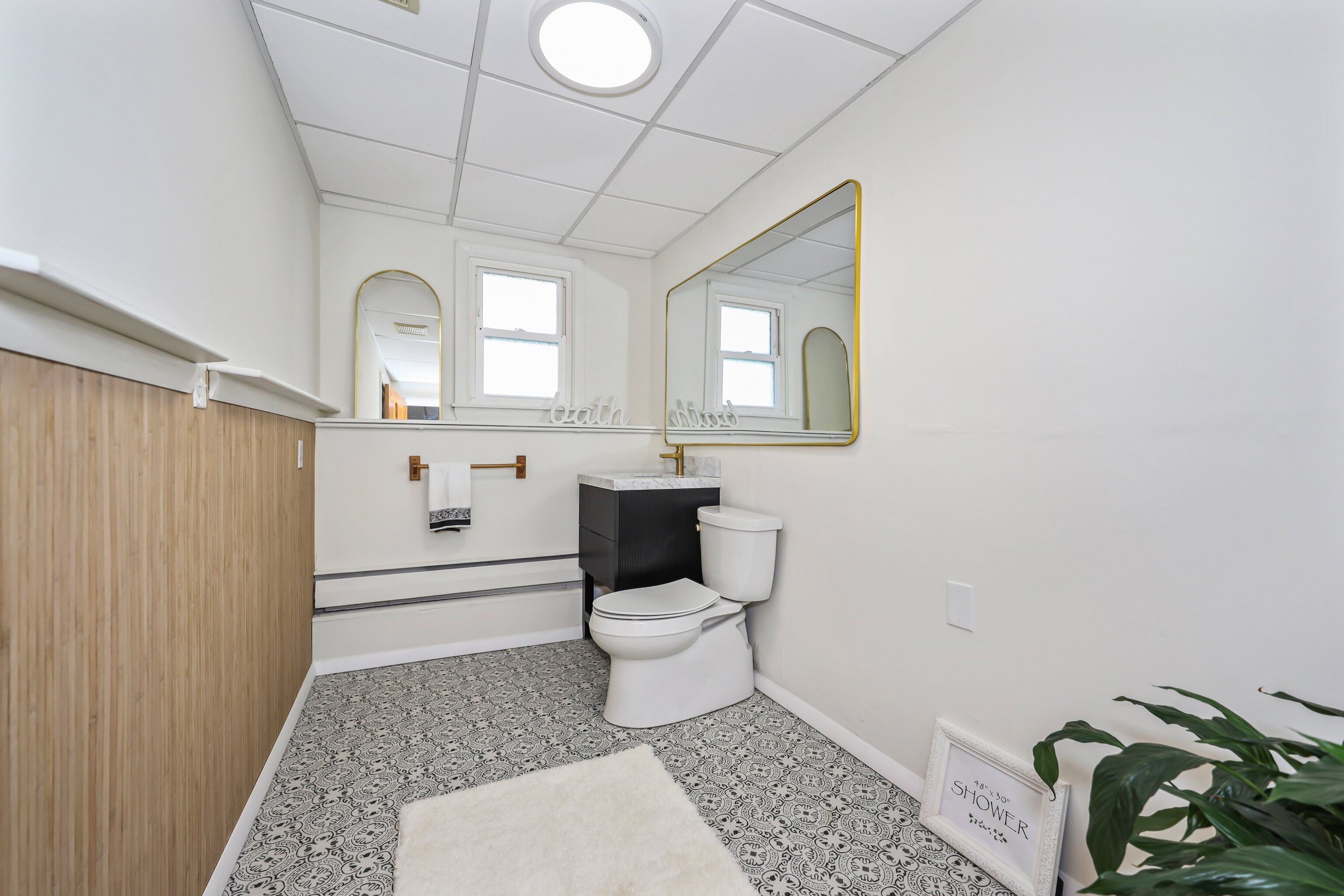 1114 Fienemann Road Farmington, CT 06032 - Photo 18 of 28 a bathroom with a toilet and a shower curtain