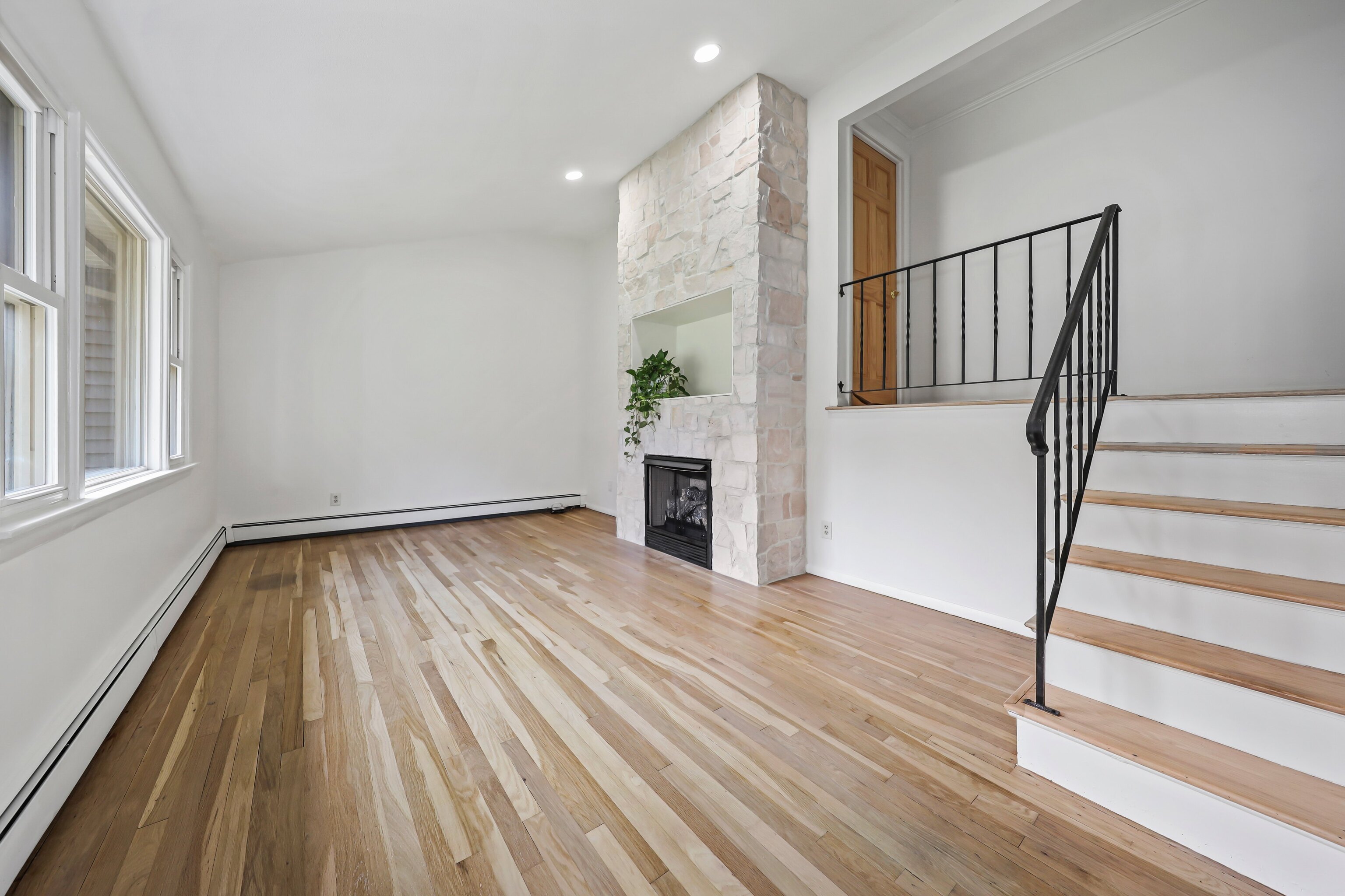 1114 Fienemann Road Farmington, CT 06032 - Photo 2 of 28 a view of empty room with wooden floor and fan