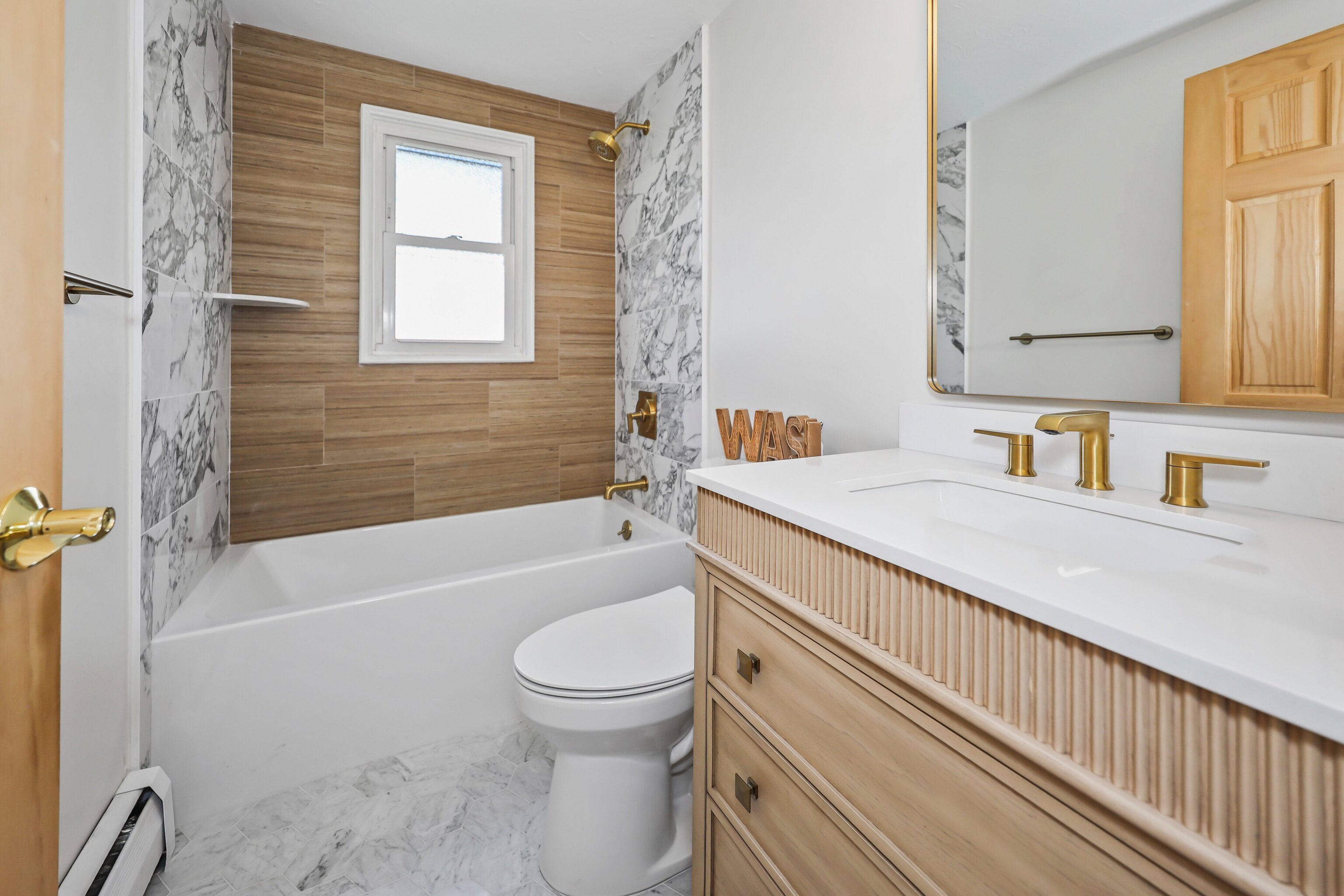 1114 Fienemann Road Farmington, CT 06032 - Photo 21 of 28 a bathroom with a sink toilet and shower