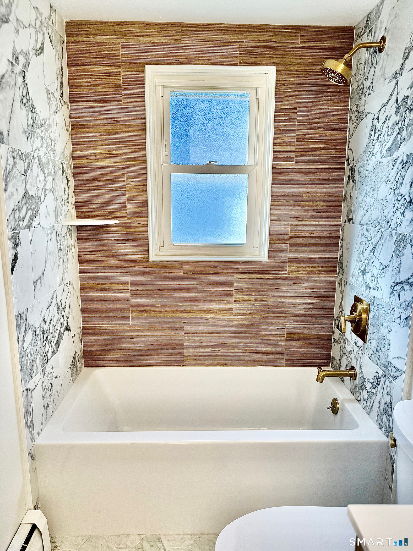 1114 Fienemann Road Farmington, CT 06032 - Photo 22 of 28 a bathroom with a bathtub and a shower