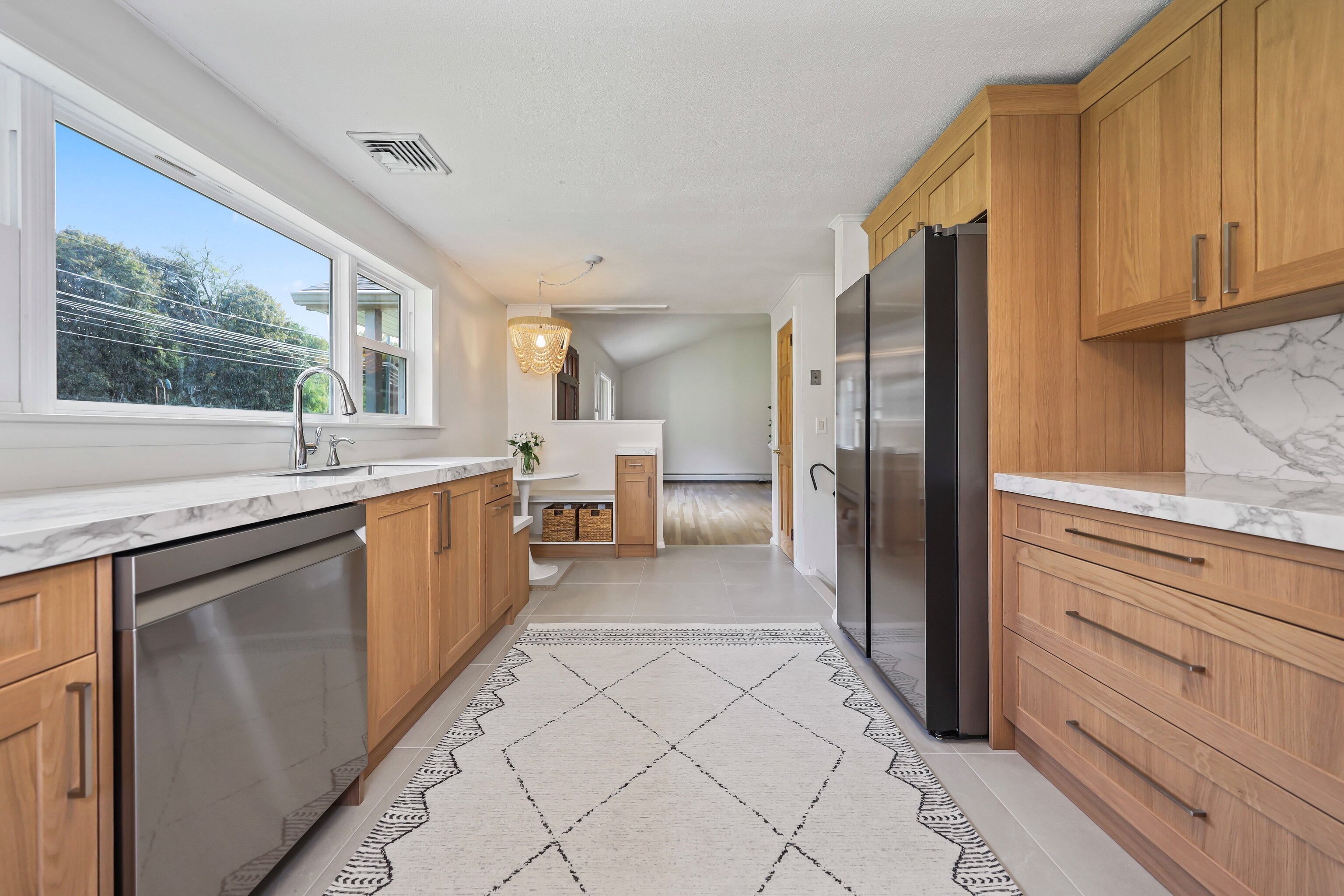 1114 Fienemann Road Farmington, CT 06032 - Photo 4 of 28 a open kitchen with stainless steel appliances granite countertop a refrigerator and a sink