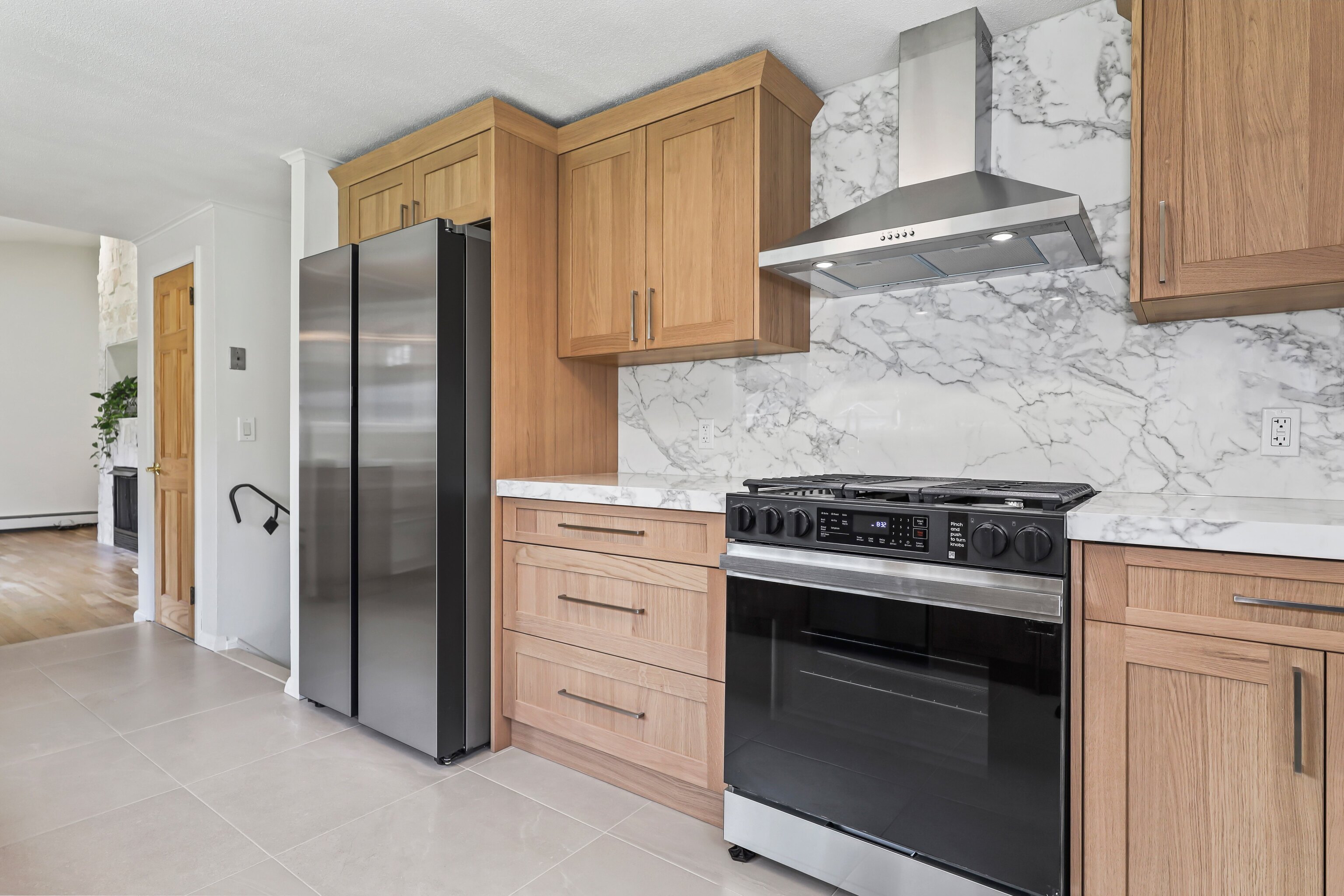 1114 Fienemann Road Farmington, CT 06032 - Photo 6 of 28 a kitchen with stainless steel appliances granite countertop a refrigerator stove and cabinets
