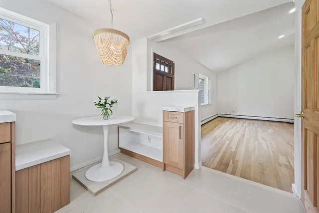 a view of an entryway with table and a window