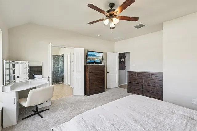 a bedroom with a bed and furniture