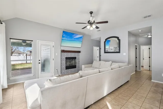 a living room with furniture and a fireplace