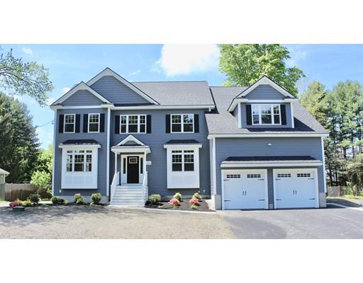 23 Manhattan Drive Burlington, MA 01803 - Photo 1 of 30 a front view of a house with a yard and garage