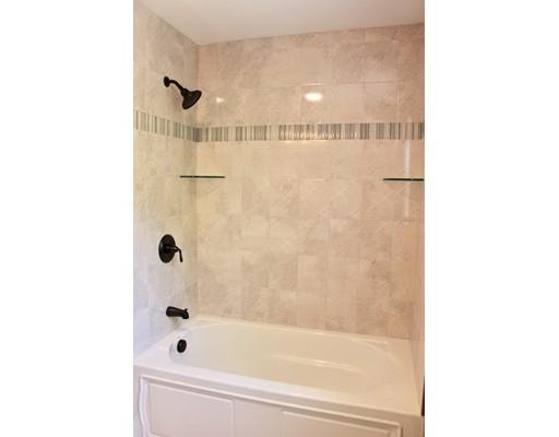 23 Manhattan Drive Burlington, MA 01803 - Photo 17 of 30 a bathroom with a bathtub and shower