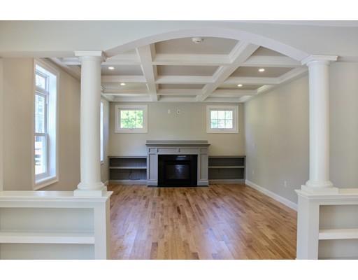 23 Manhattan Drive Burlington, MA 01803 - Photo 4 of 30 a view of an empty room with wooden floor fireplace and a window
