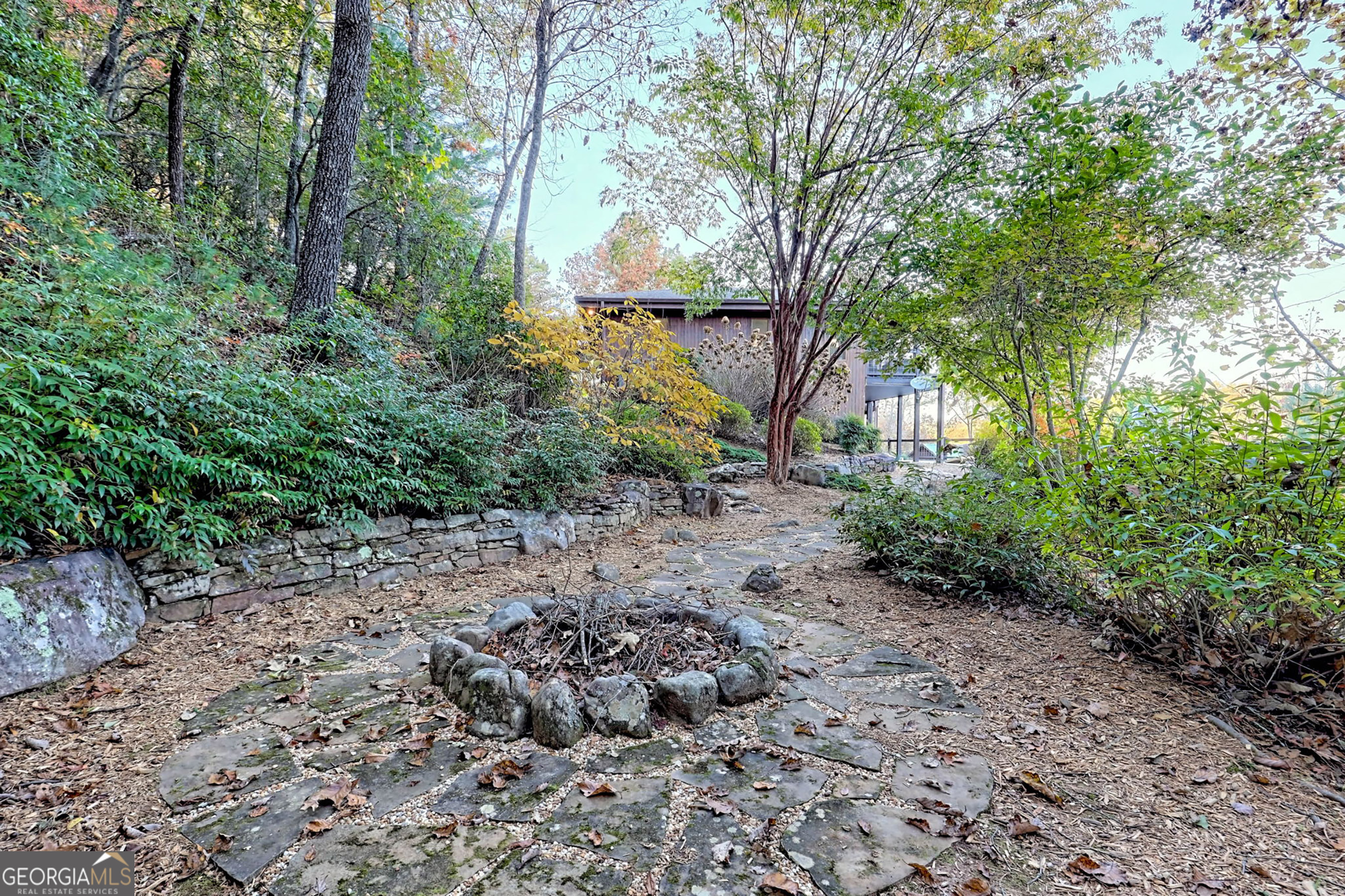 9406 Bridge Creek Road Tiger, GA 30576 - Photo 111 of 197 a view of a yard with plants and large trees