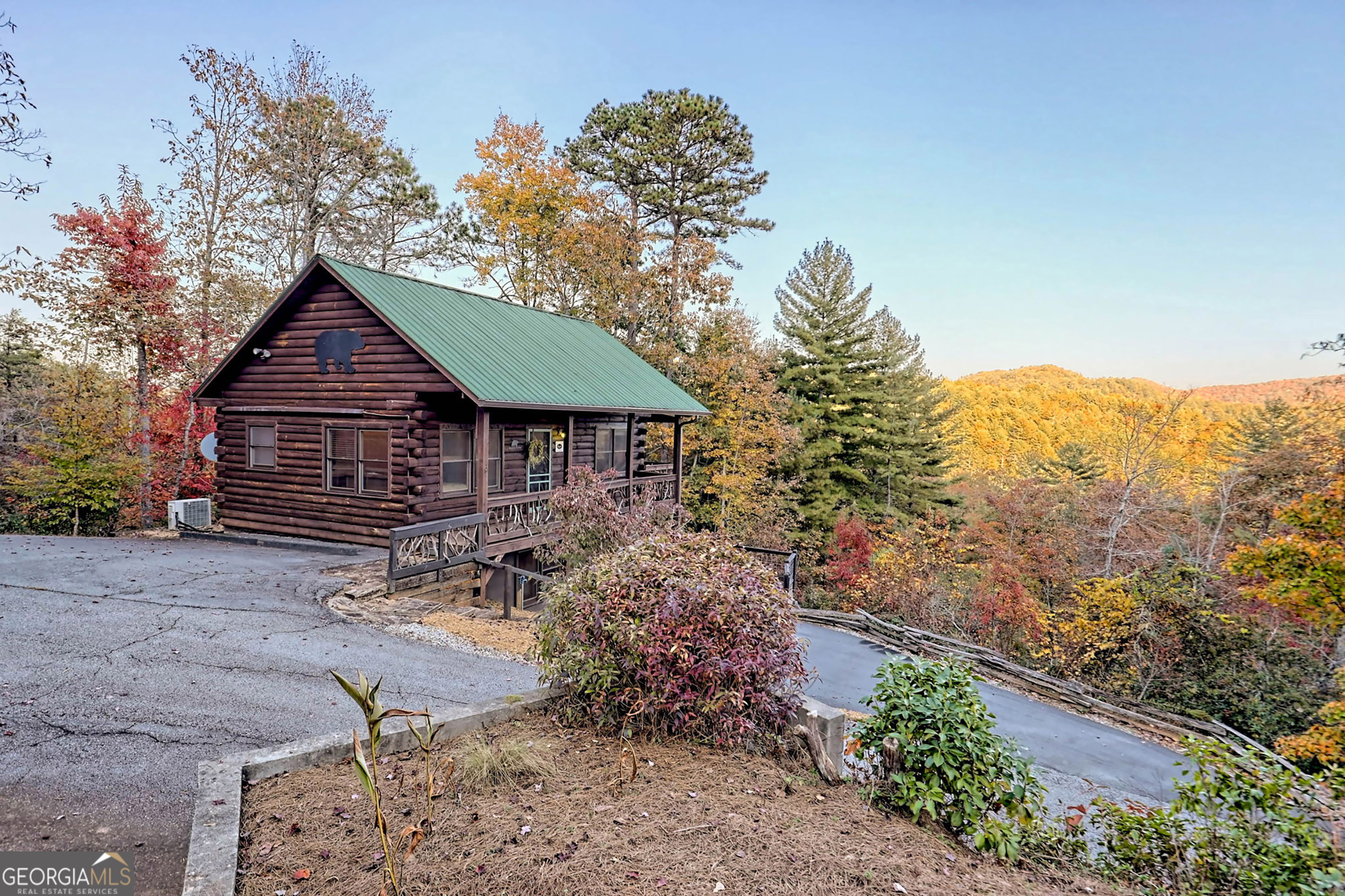 9406 Bridge Creek Road Tiger, GA 30576 - Photo 180 of 197 a front view of a house with a yard and mountain view in back