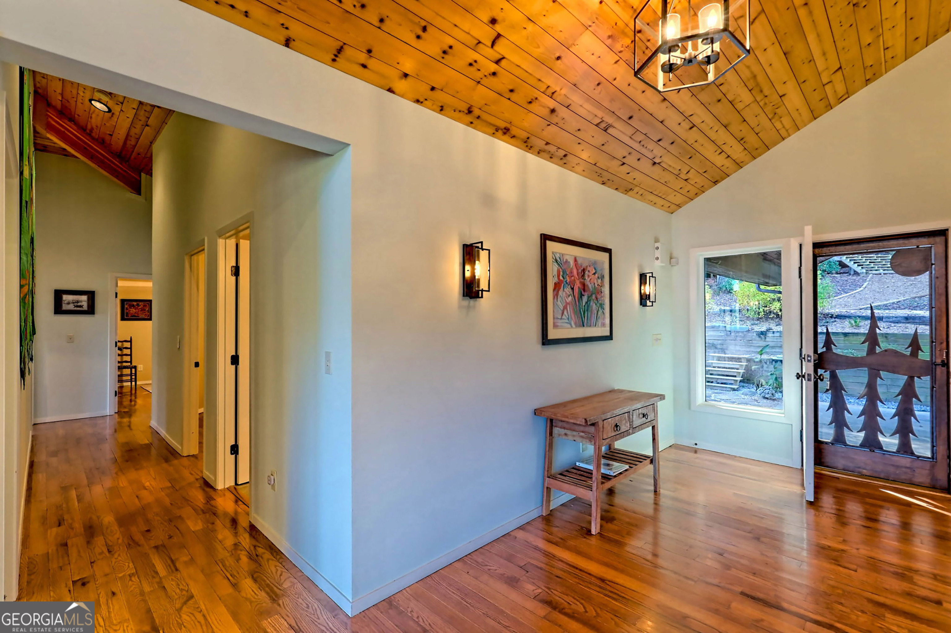 9406 Bridge Creek Road Tiger, GA 30576 - Photo 34 of 197 a view of a hallway with wooden floor and furniture
