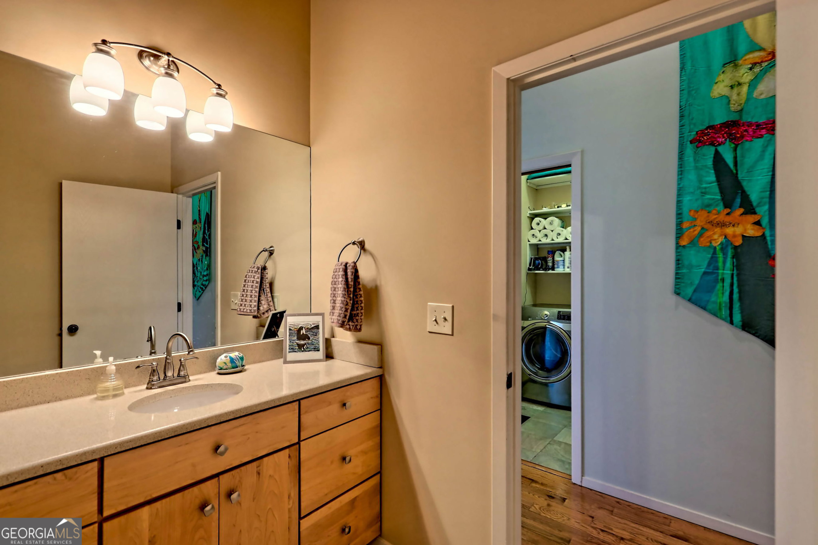 9406 Bridge Creek Road Tiger, GA 30576 - Photo 69 of 197 a bathroom with a sink a vanity and a mirror