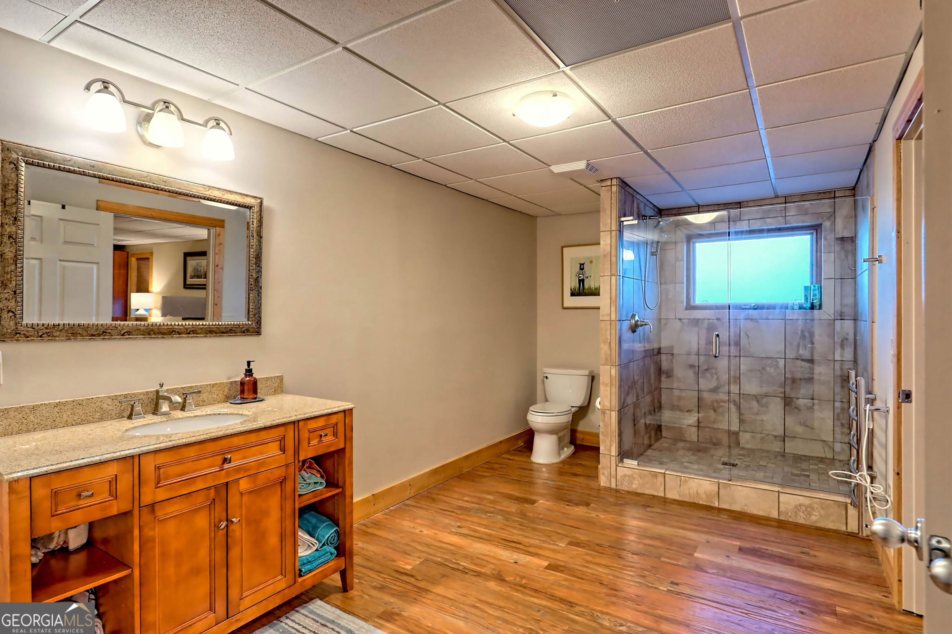 9406 Bridge Creek Road Tiger, GA 30576 - Photo 90 of 197 a bathroom with a sink mirror and a shower