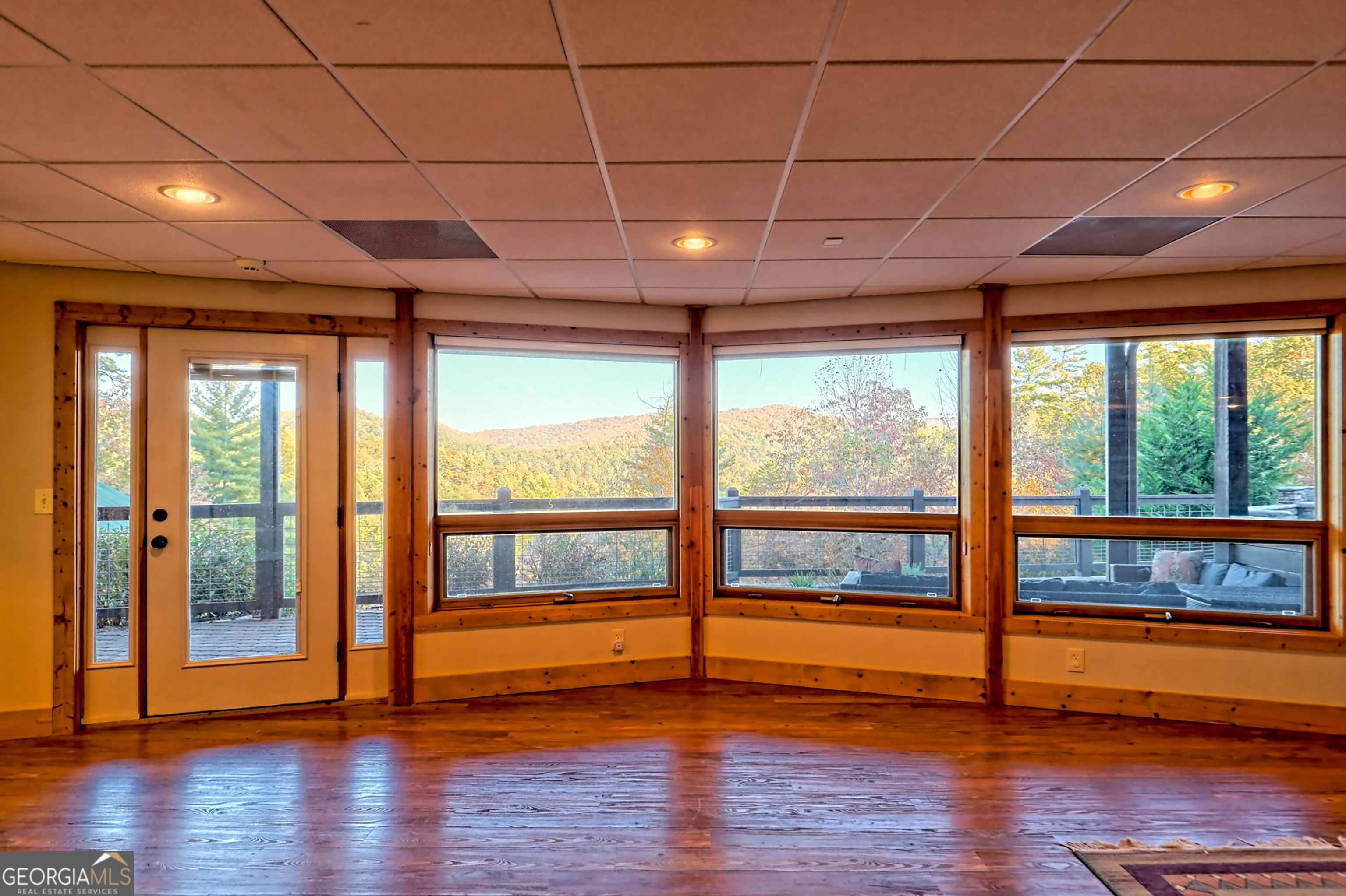 9406 Bridge Creek Road Tiger, GA 30576 - Photo 100 of 197 a view of empty room with wooden floor and fan