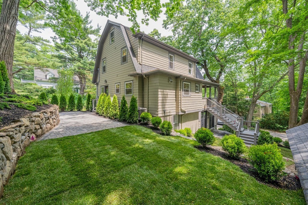 26 Locust Avenue Lexington, MA 02421 - Photo 41 of 42 a front view of a house with a yard and trees