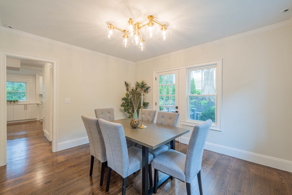26 Locust Avenue Lexington, MA 02421 - Photo 7 of 42 a view of a dining room with furniture a chandelier and wooden floor