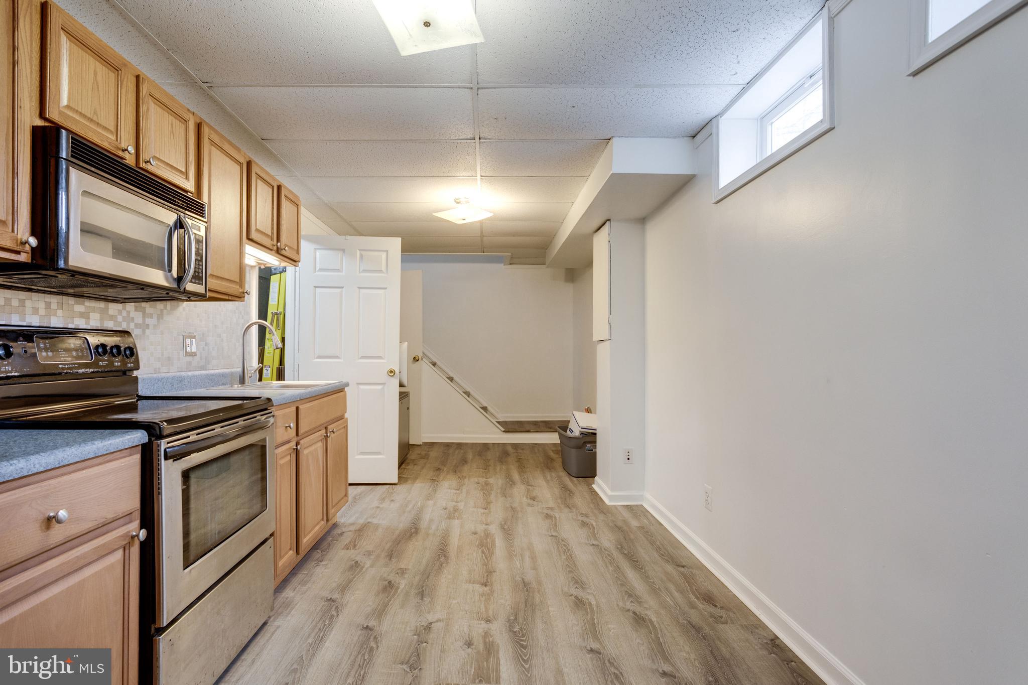 12204 Golden Sands Lane Reston, VA 20191 - Photo 35 of 48 Full lower level kitchen