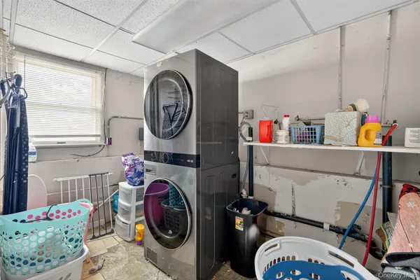 a view of storage and utility room with a window