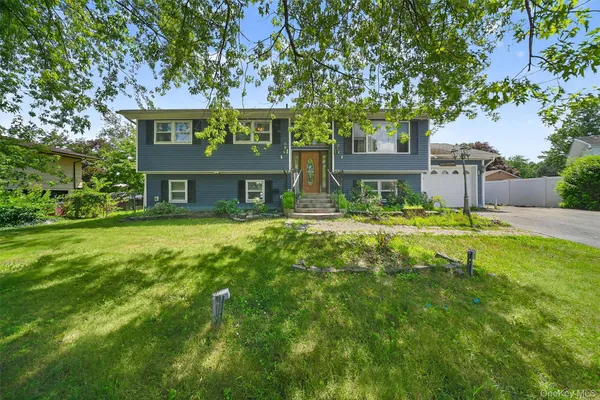 a front view of a building with garden