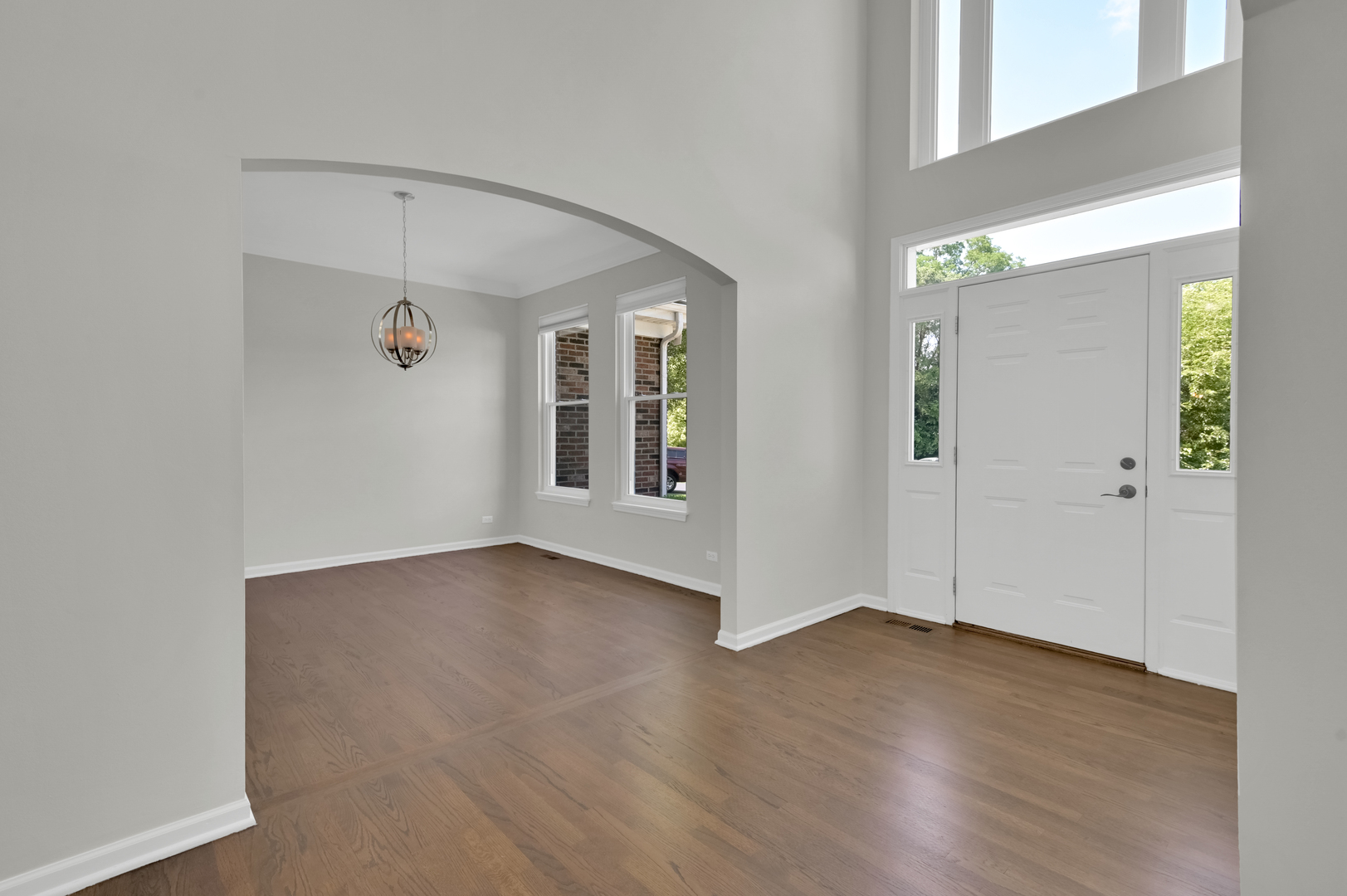 502 Windsor Circle Fox River Grove, IL 60021 - Photo 5 of 41 an empty room with wooden floor and windows