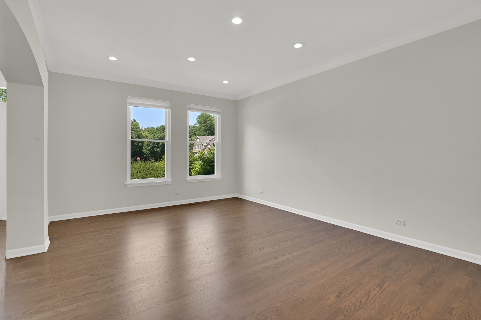 502 Windsor Circle Fox River Grove, IL 60021 - Photo 7 of 41 an empty room with wooden floor and windows