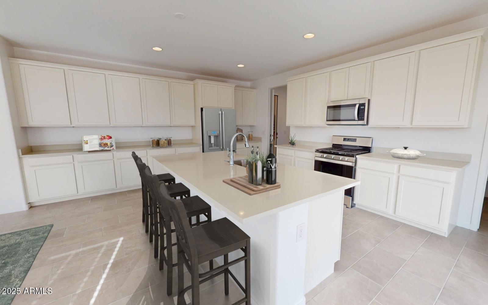 1228 Ridge Road Apache Junction, AZ 85120 - Photo 5 of 45 a kitchen with stainless steel appliances a white table chairs and a refrigerator